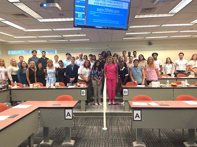 Dr. Strimbu with BUSPM Students